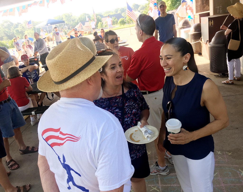 Sharice Davids, a Democrat running for Congress in Kansas, talks to supporters at a July 4 event in Prairie Village. (Photo by David Weigel/The Washington Post via Getty Images)