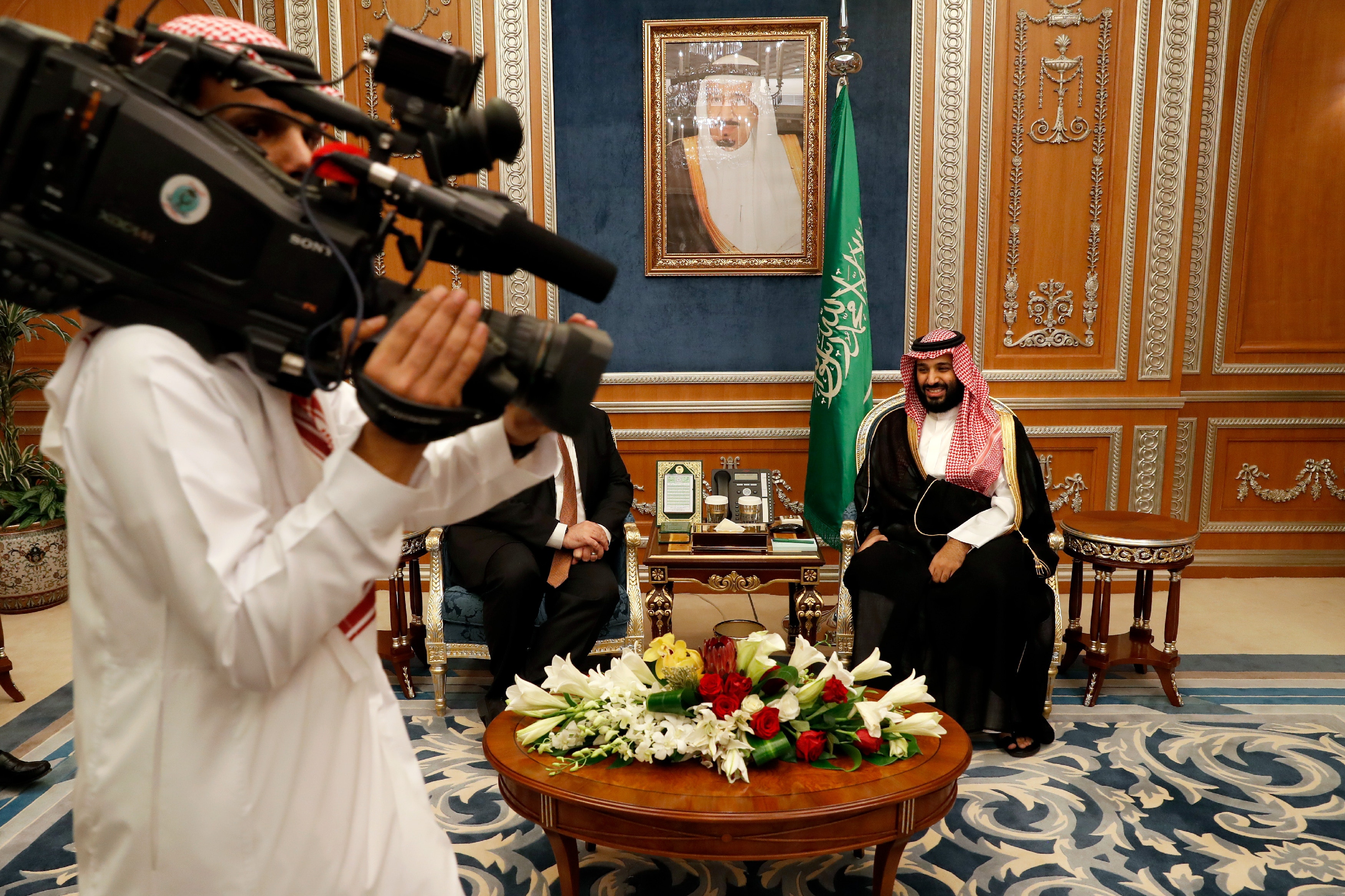 A cameraman gets into position as U.S. Secretary of State Mike Pompeo meets with Saudi Crown Prince Mohammed bin Salman, in Riyadh, Saudi Arabia, Tuesday Oct. 16, 2018. Pompeo also met on Tuesday with Saudi King Salman over the disappearance and alleged slaying of Saudi writer Jamal Khashoggi, who vanished two weeks ago during a visit to the Saudi Consulate in Istanbul. (Leah Millis/Pool via AP)