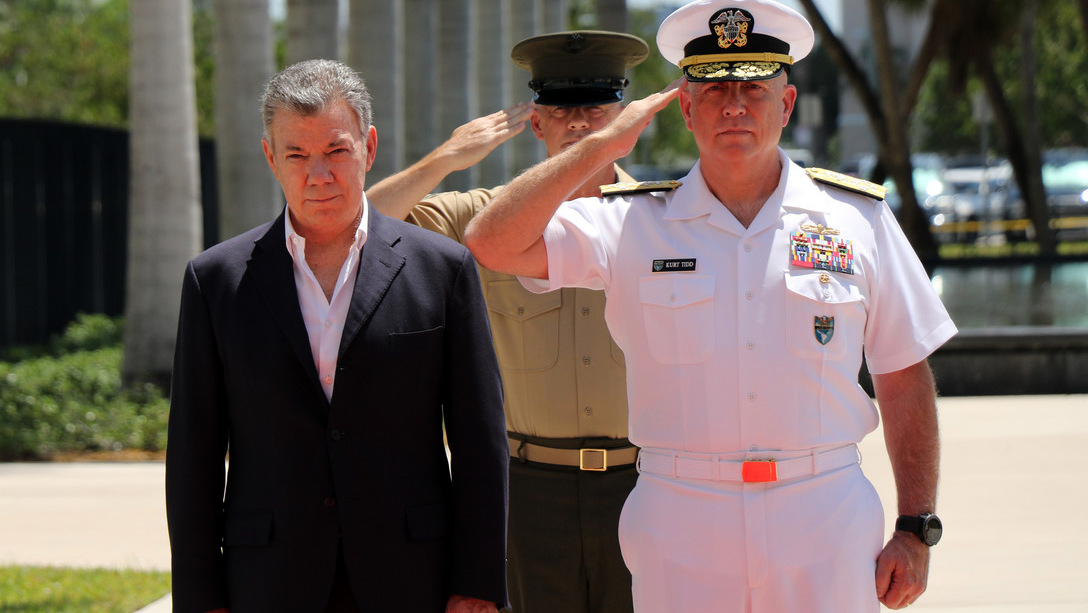 Colombian President Juan Manuel Santos, flanked by SOUTHCOM admirals, arrives at SOUTHCOM's Colombia military headquarters. Jose Ruiz | DoD
