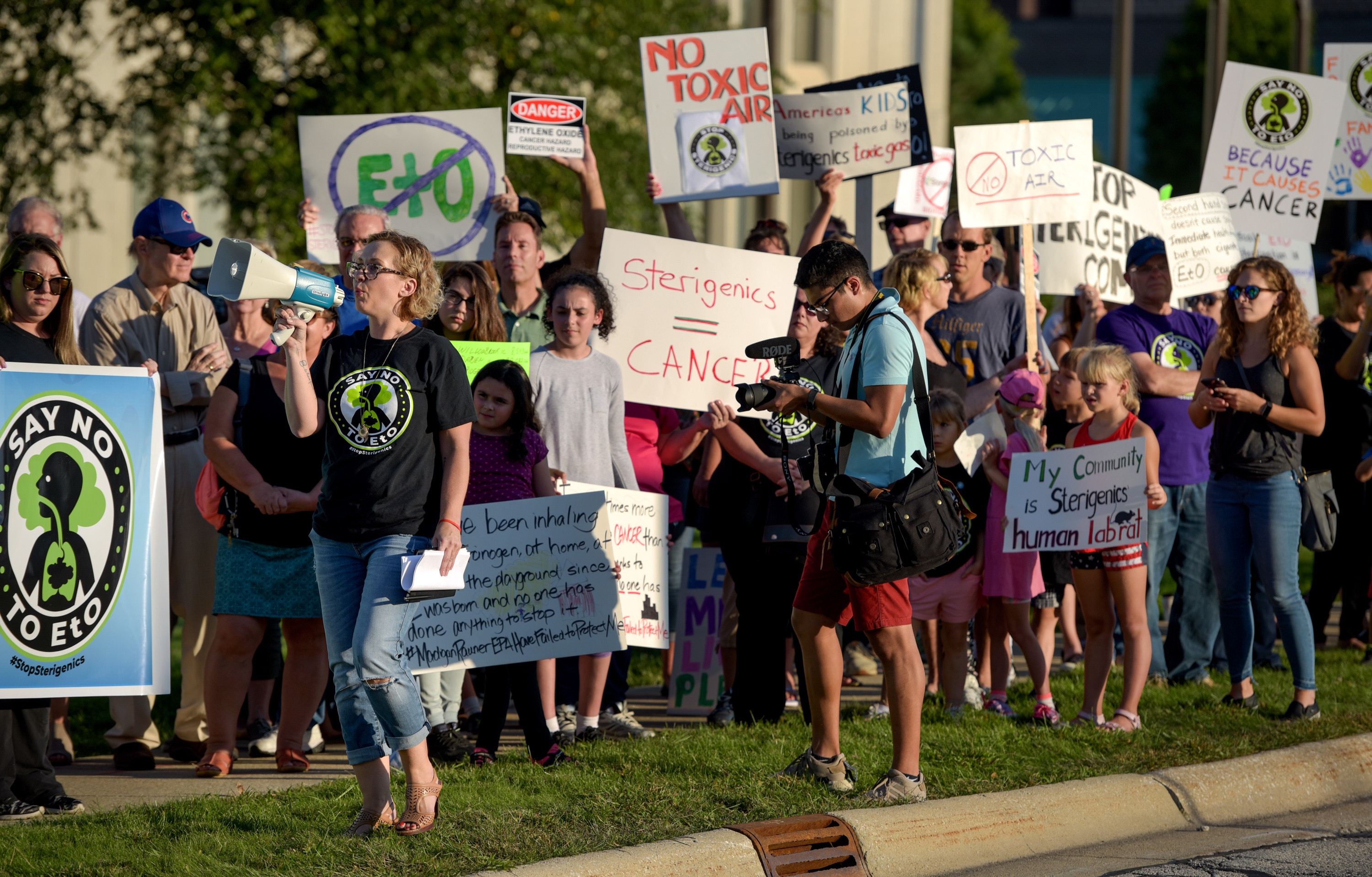Protest organizer Neringa Zymancius of Darian leads the protesters in a chant in front of the Oak Brook headquarters of Sterigenics Friday, Sept. 14, 2018 in Oak Brook, Ill. Sterigenics uses ethylene oxide gas in nearby Willowbrook to sterilize items as part of their business. (Mark Black/Chicago Tribune/TNS via Getty Images)