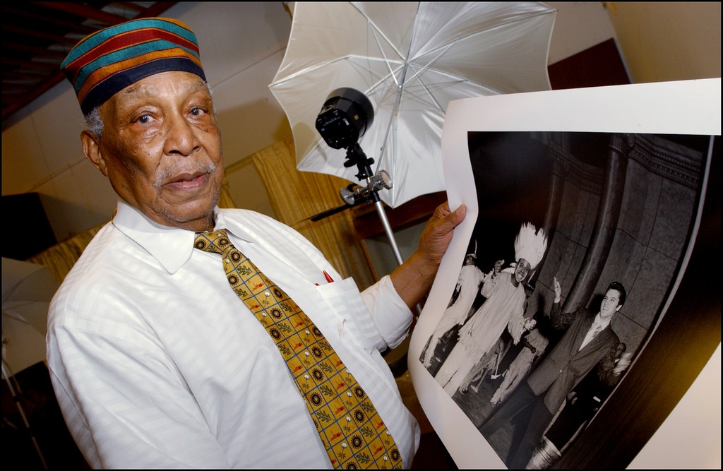 UNITED STATES - MAY 01:  Ernest C - Withers, 80 years old, is the most famous photographer in Memphis - Here is showing his photograph of Elvis Presley and Rufus Thomas - On the tracks of the King, 25 years after his death in United States in May, 2002.  (Photo by David LEFRANC/Gamma-Rapho via Getty Images)