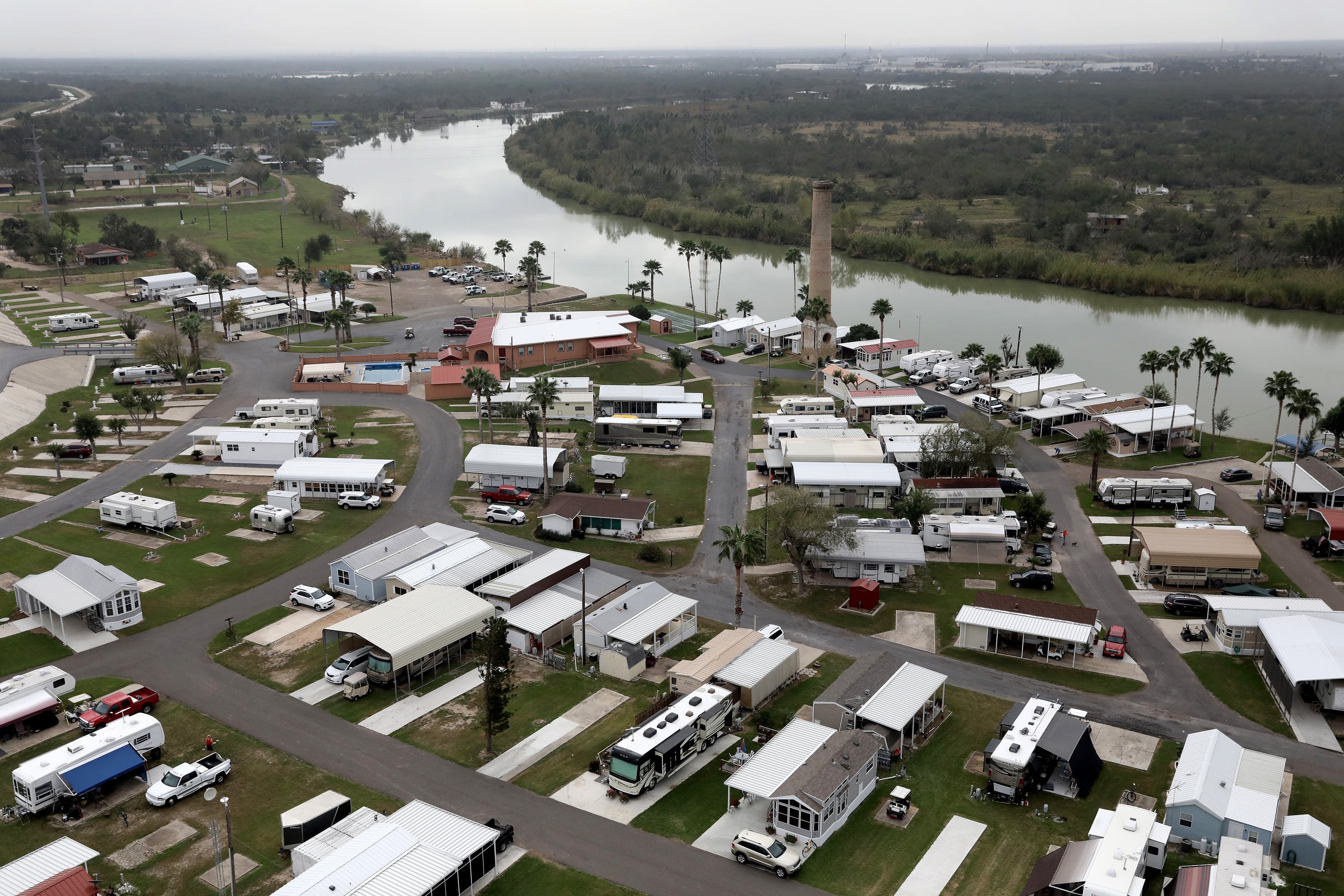 LOS EBANOS, TX - JANUARY 05:  An RV community sits on the bank of the Rio Grande at the U.S.-Mexico border on January 5, 2017 near Los Ebanos, Texas. The number of illegal immigrants passing through such areas has surged ahead of the upcoming Presidential inauguration of Donald Trump, who has pledged to build a wall along the U.S.-Mexico border.  (Photo by John Moore/Getty Images)
