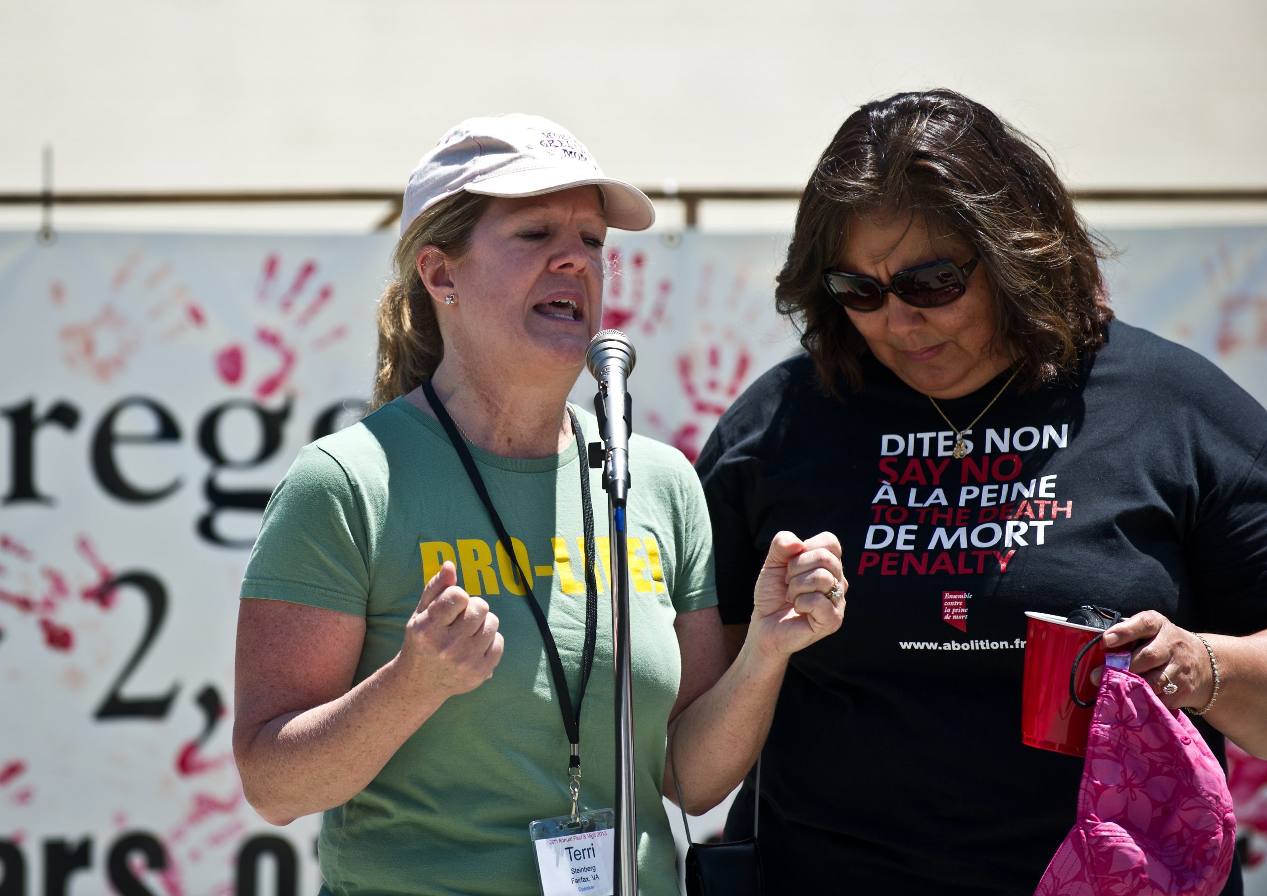 Terri Steinberg (L), whose son is on death row, speaks with Delia Perez Meyer, whose brother is on death row, during the 20th annual Starvin' for Justice fast and vigil against the death penalty in front of the US Supreme Court in Washington on June 29, 2013.