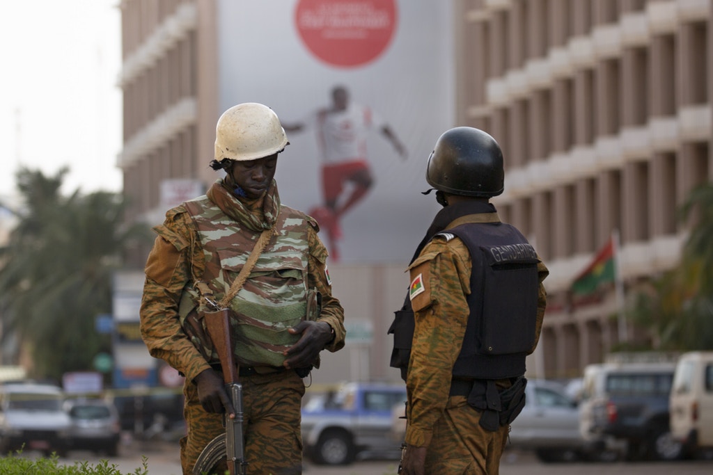 Security forces stand guard after an Al Qaeda attack that killed 30 people in a restaurant and hotel in Ouagadougou, Burkina Faso, January 16, 2016. Joe Penney